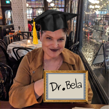 Poorly edited photo of Bela wearing a graduation cap and holding a "Dr. Bela" degree.