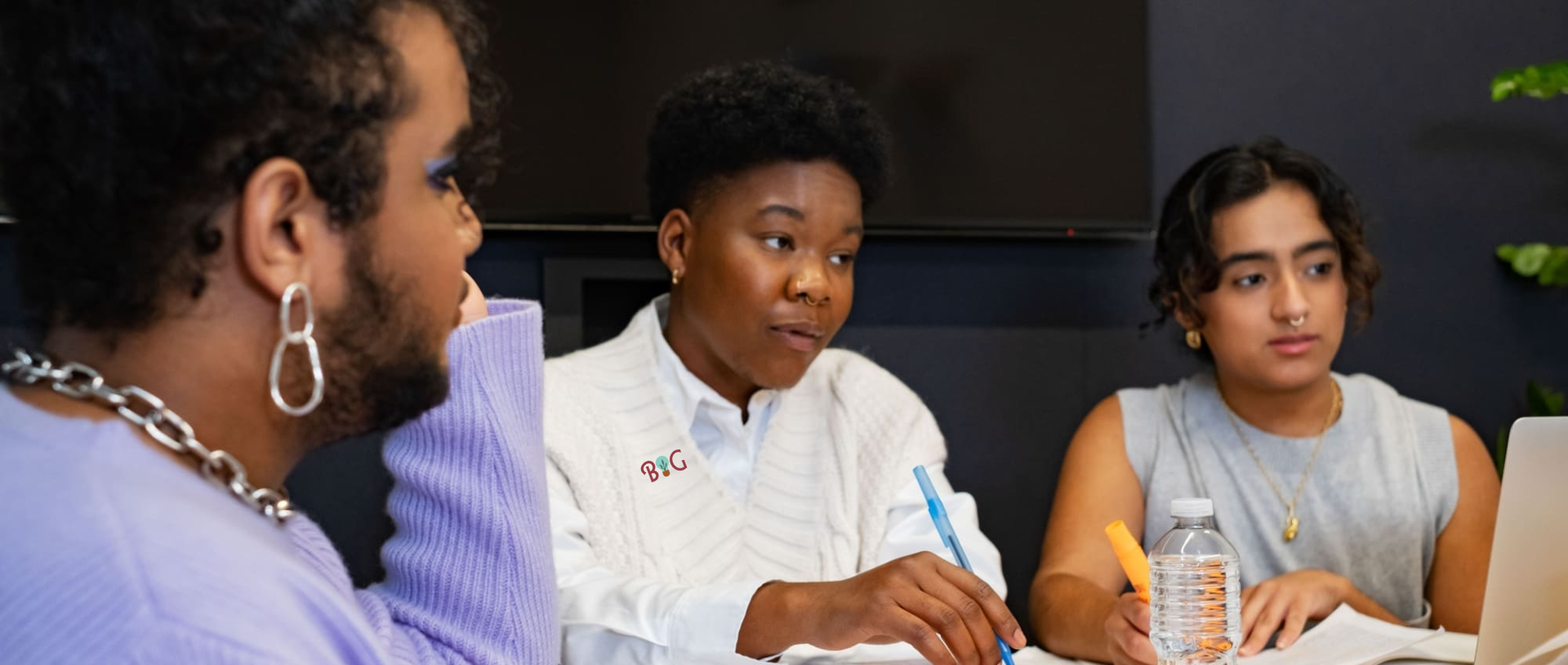 3 gender-diverse folks of color in a meeting